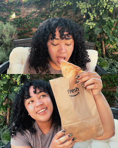 A woman with curly hair enjoying snacks outdoors, one version on top is holding a paper bag with a croissant or pastry, and the other is sitting below looking up at her with Amazon Fresh logo. This showcases creative use of 3D space.