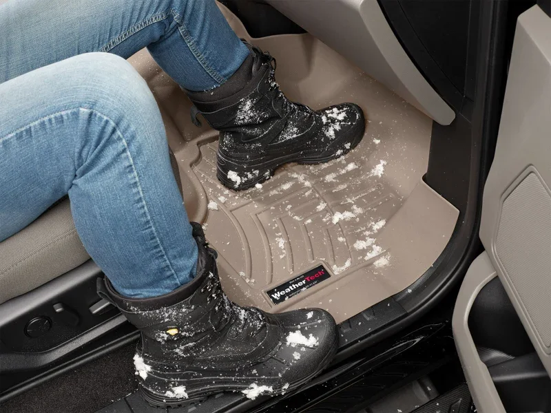 WeatherTech digital fit floor liner protecting vehicle carpet from snow and mud — available at Xtreme Car & Truck Accessories, Bridgeville, PA near Pittsburgh