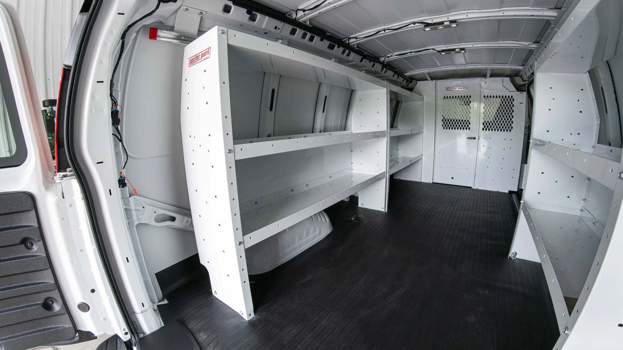 Finished Chevy Express cargo van upfit with WeatherGuard shelving installed by Xtreme Car and Truck Accessories in Bridgeville, PA