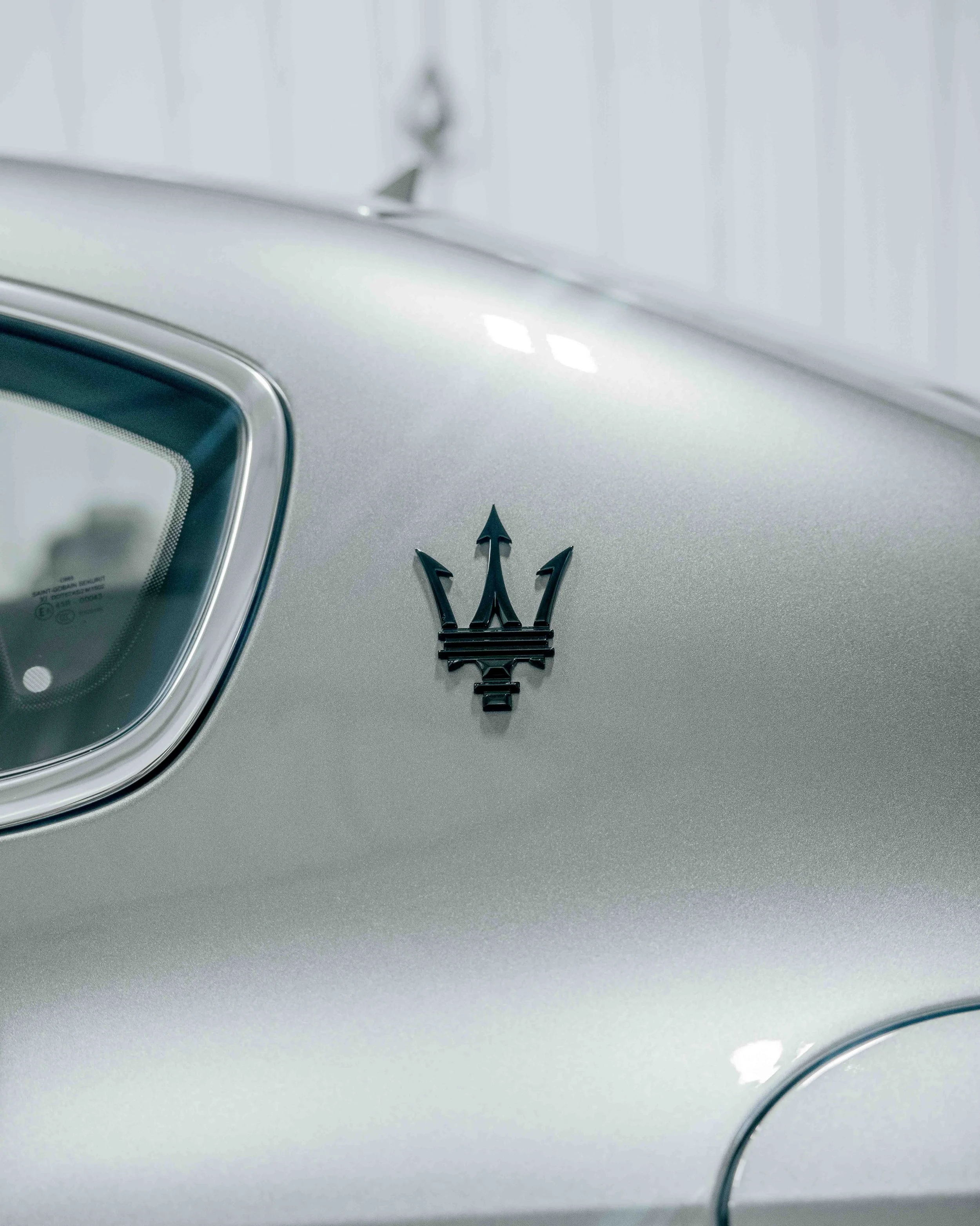 Maserati Ghibli Q4 C-pillar trident badge detail after paint correction at Xtreme Car and Truck Accessories in Bridgeville, PA
