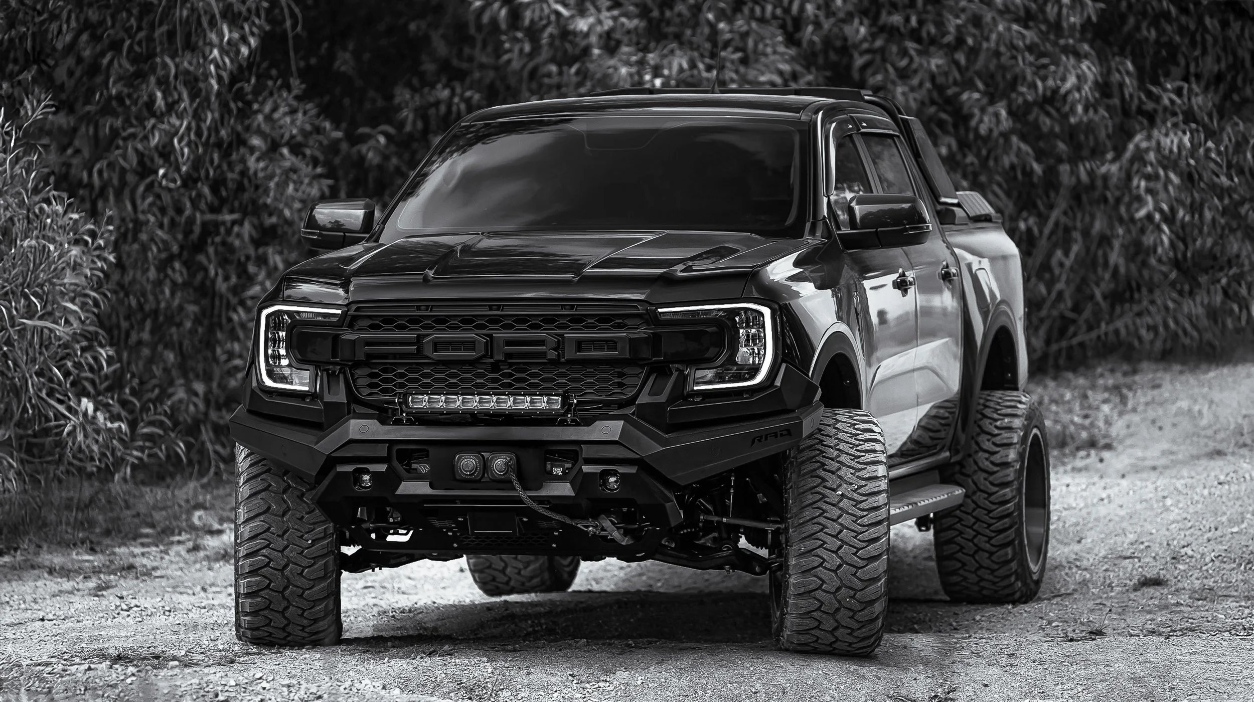 Lifted Ford F-150 with off-road tires and aftermarket front bumper at Xtreme Car & Truck Accessories in Bridgeville, PA near Pittsburgh and the South Hills.