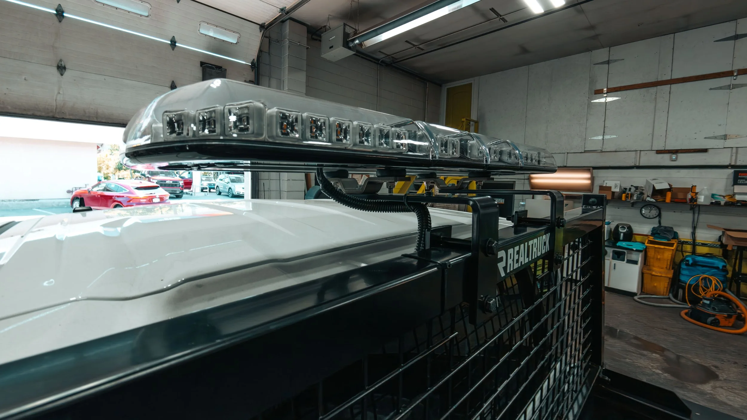 LED light bar and amber warning lights installed on a commercial work truck at Xtreme Car & Truck Accessories near Pittsburgh, PA.