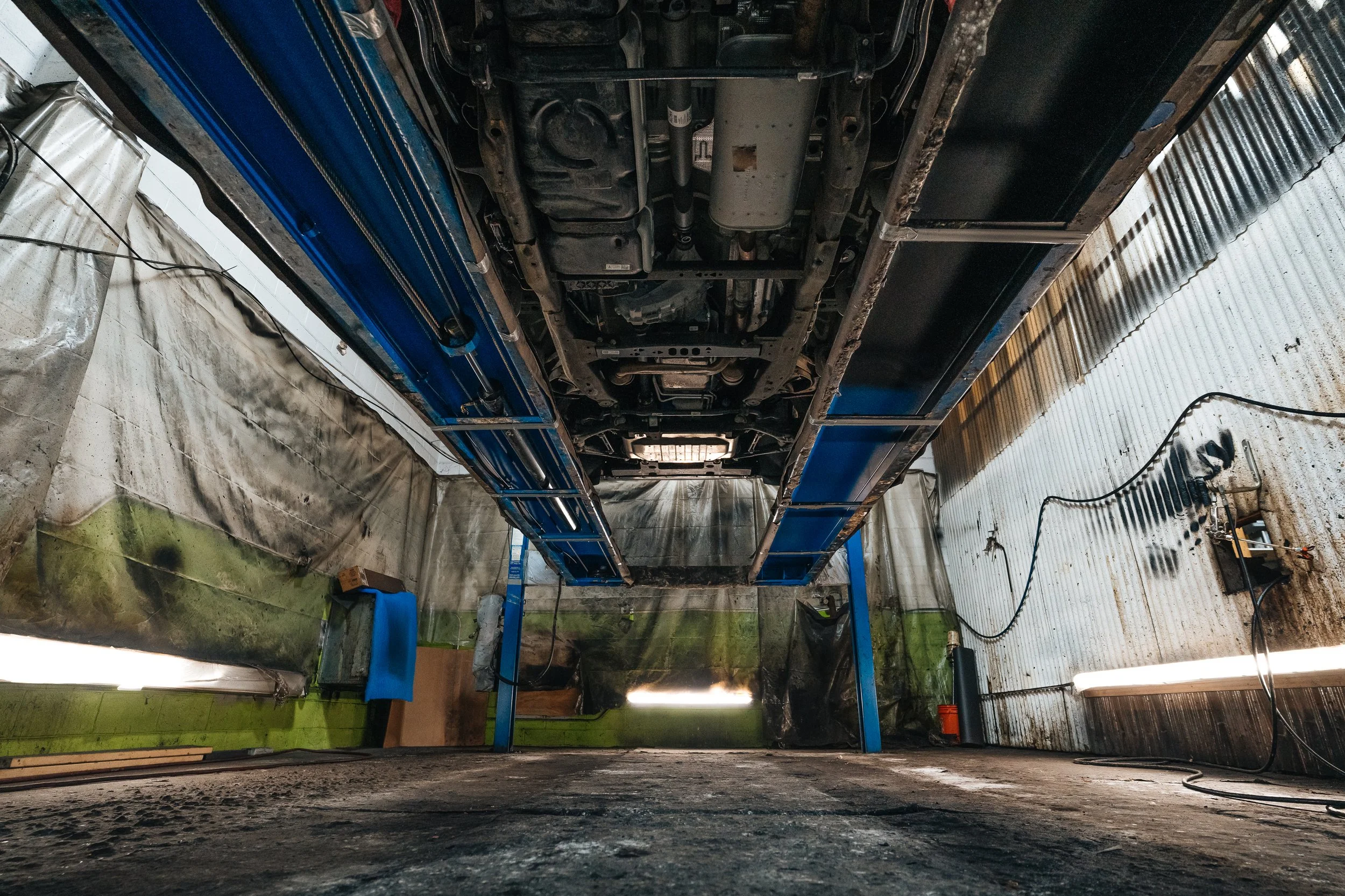 Professional truck undercarriage rustproofing service at Xtreme Car & Truck Accessories in Bridgeville PA showing vehicle on lift for undercoating application