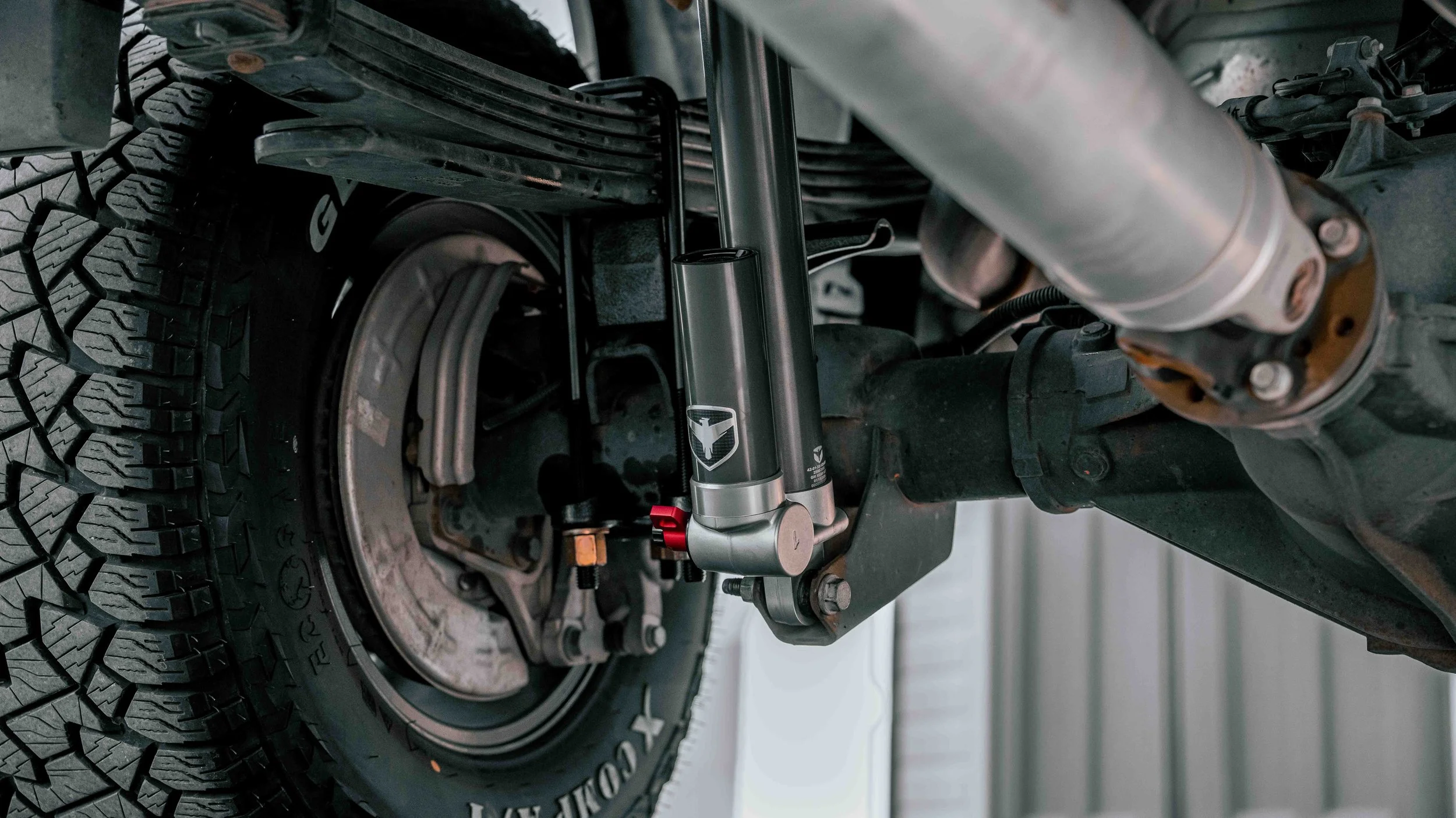 Rear Falcon shock and suspension components on a lifted GMC Sierra ReadyLIFT install at Xtreme Car & Truck Accessories.