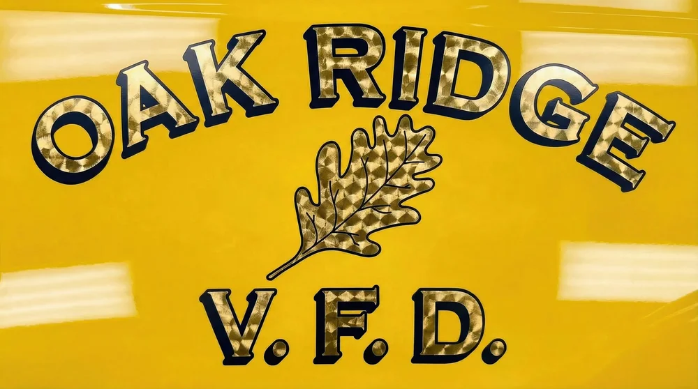 Close-up of Oak Ridge VFD emergency vehicle lettering with gold vinyl graphics installed by Xtreme Car and Truck Accessories in Bridgeville PA