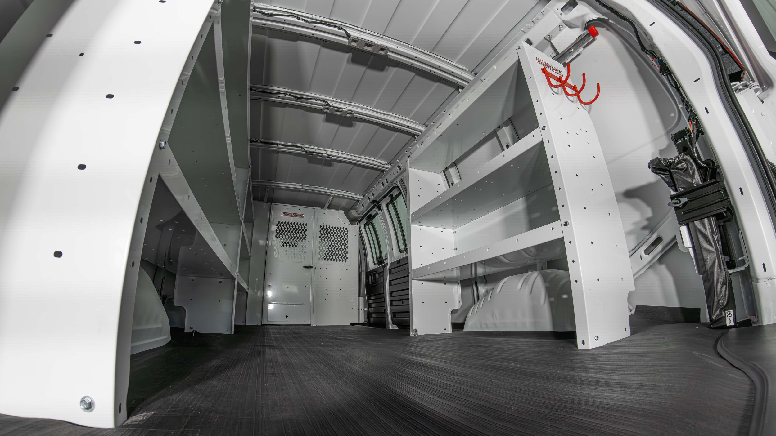 WeatherGuard shelving with red accessory hooks and organized tool storage in a Chevy Express van