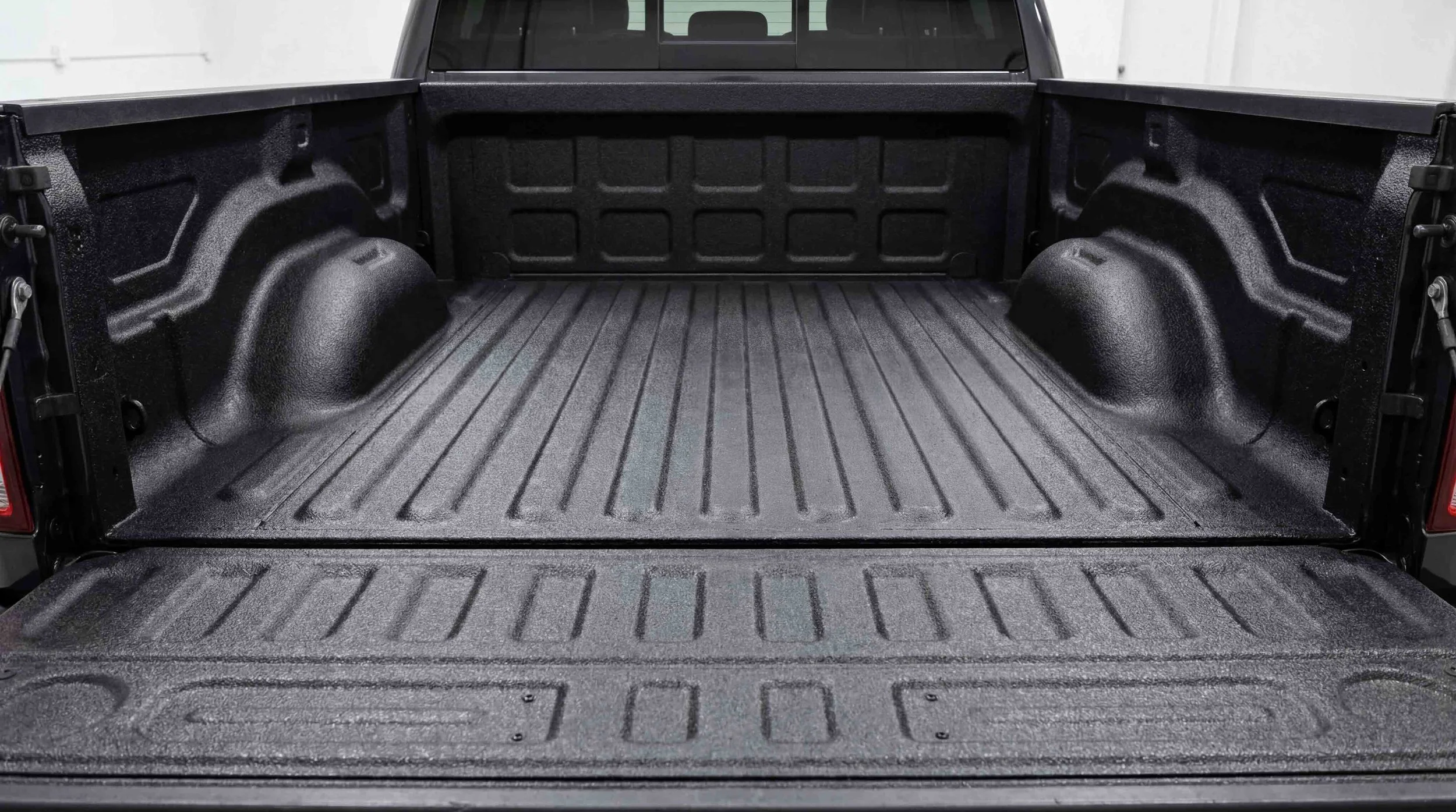 Finished professional spray-in bed liner installed by Xtreme Car & Truck Accessories in Bridgeville, PA, showing full truck bed coverage, durable black textured coating, and a clean permanent fit.