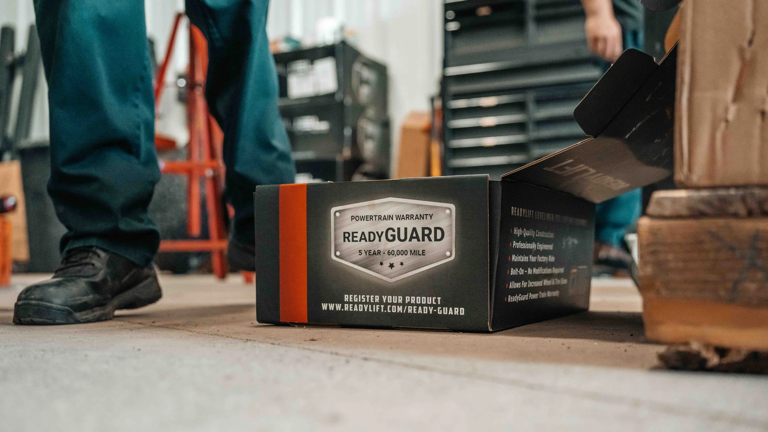ReadyLIFT ReadyGuard box on the shop floor during a GMC Sierra suspension lift installation at Xtreme Car & Truck.