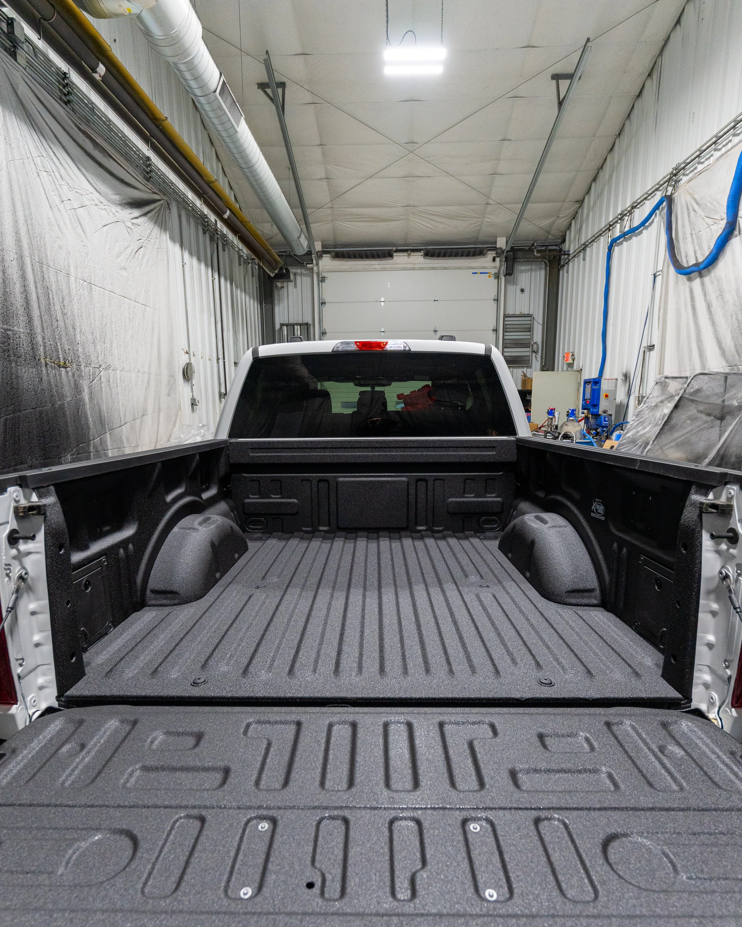 Freshly installed spray-in bedliner in a pickup truck bed at Xtreme Car & Truck Accessories in Bridgeville, PA.