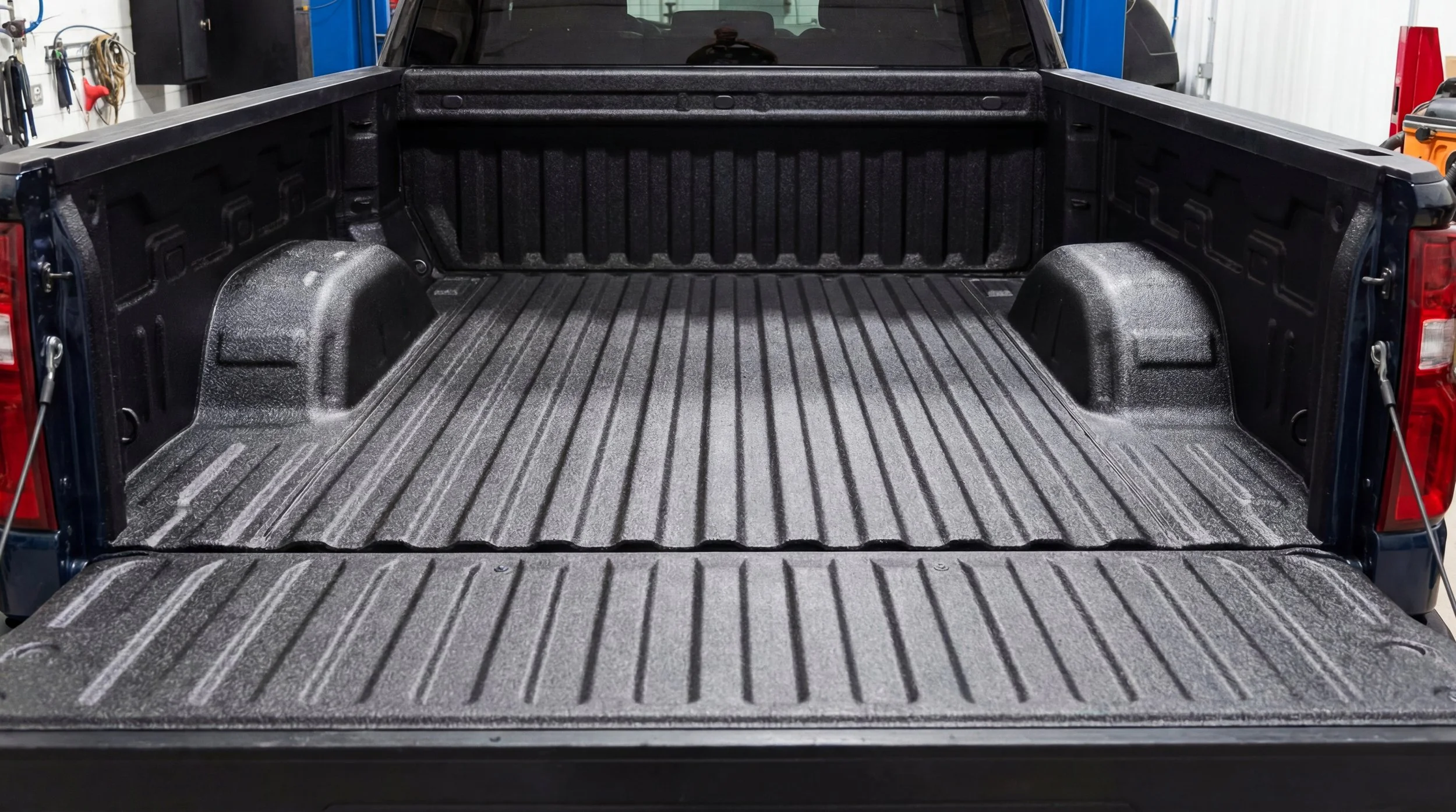 Xtreme Car & Truck professional spray-in bed liner installation on a pickup truck in Bridgeville, PA, showing a freshly coated black textured truck bed with durable full-bed protection and a clean finished appearance.
