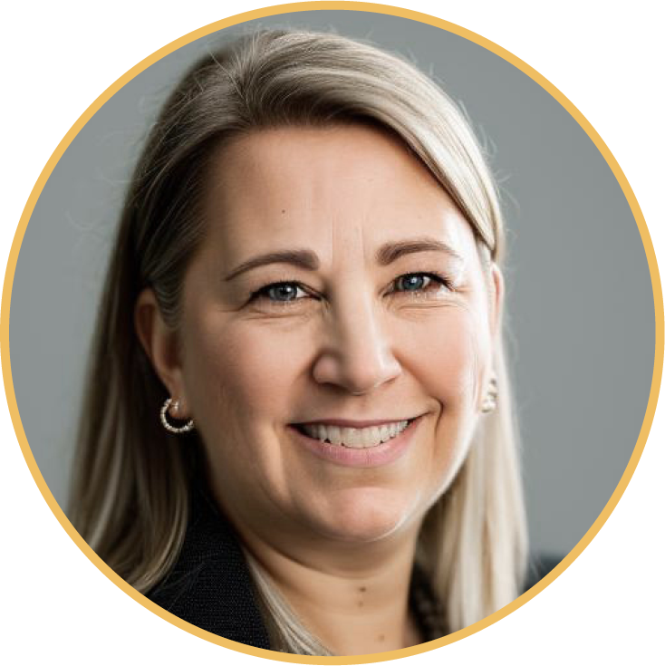 A headshot of a smiling blonde woman with blue eyes, wearing earrings, against a gray background.