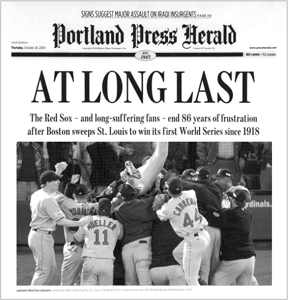 Front page of the Portland Press Herald newspaper from October 28, 2004, featuring a headline about the Boston Red Sox winning their first World Series since 1918. The photo shows Red Sox players celebrating on the field.