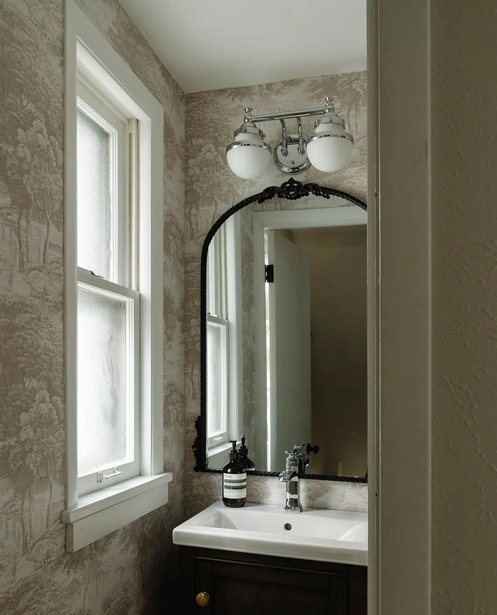 A powder room is the perfect place to add character.⁠
⁠
Whether you go bold with color or creative with wallpaper, a small space can carry big personality. Because in a powder room, you have the freedom to take risks &mdash; dramatic lighting, statem
