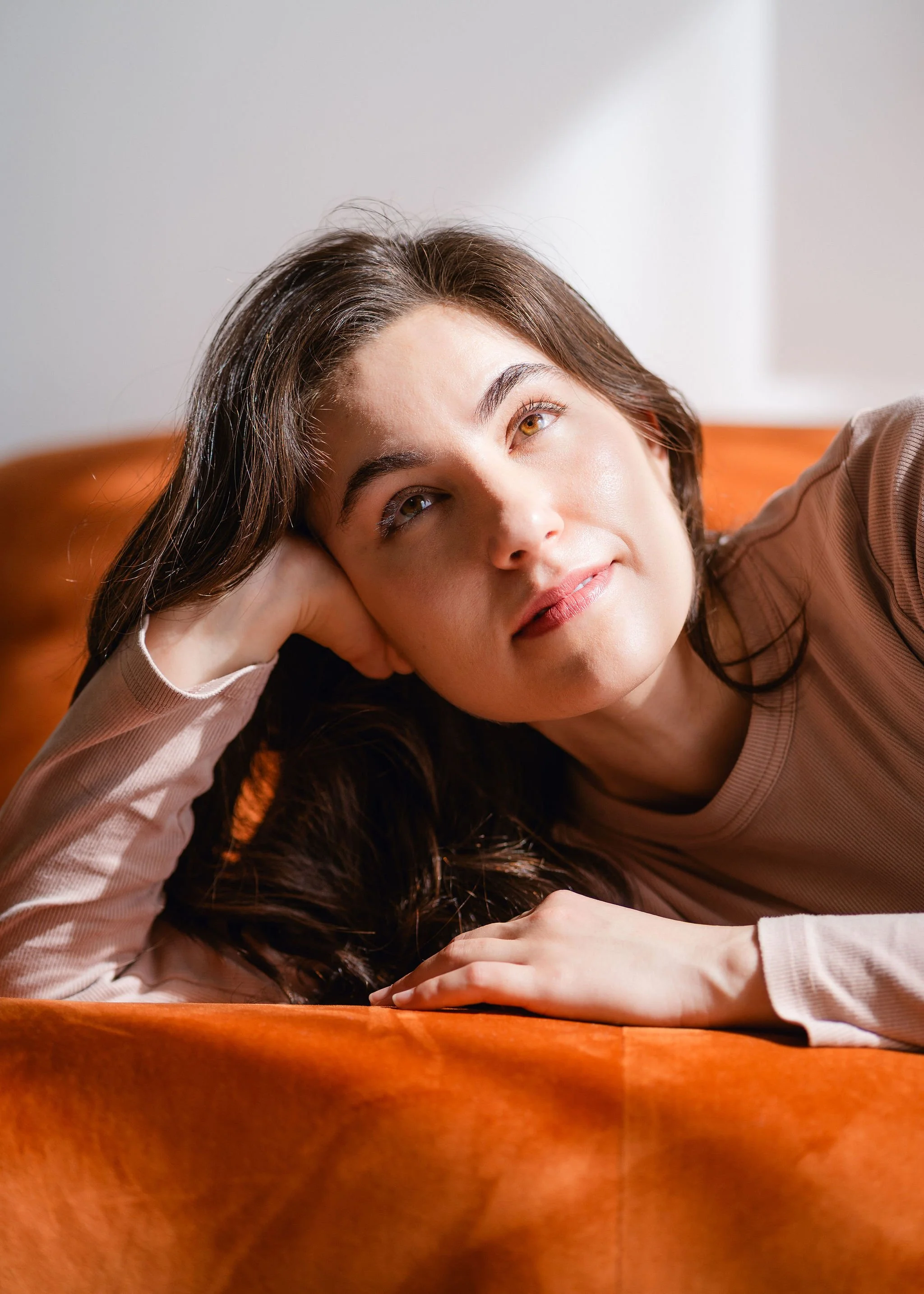 Monauar rests on the couch and looks up