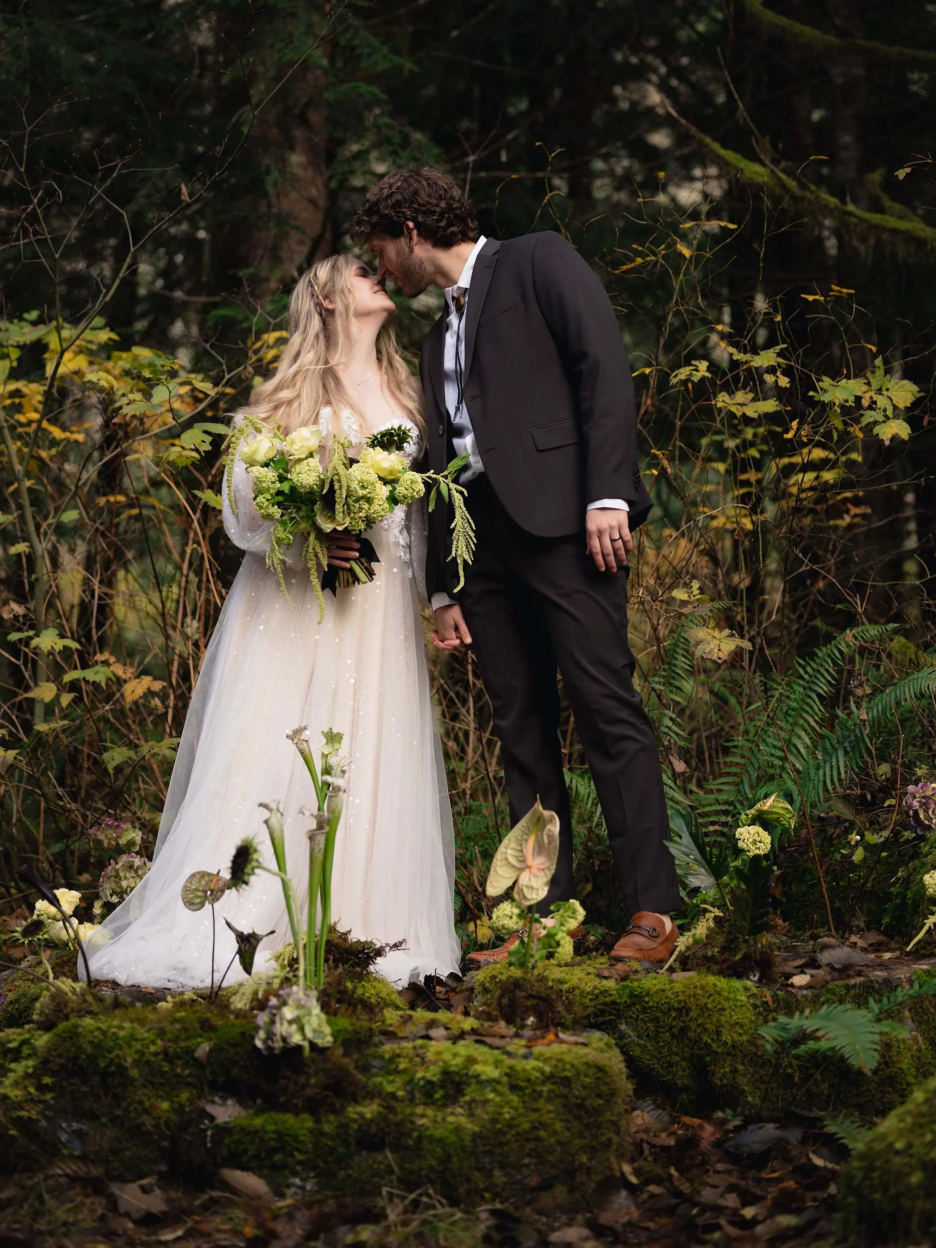 Whimsical PNW couple elope on a large moss-covered rock alter