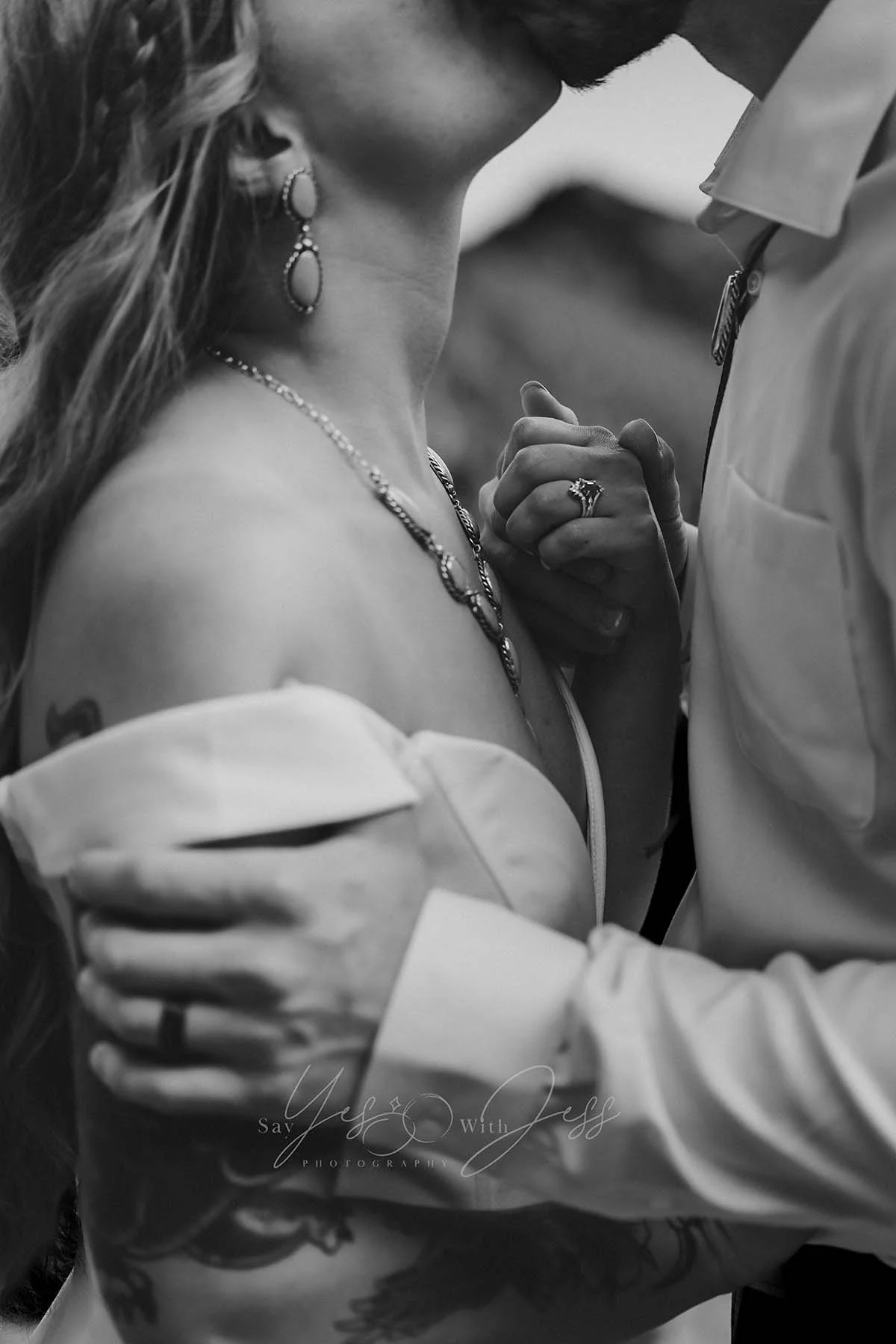 The bride and groom share romantic kiss during their elopement at Tipsoo Lake at Mount Rainier.