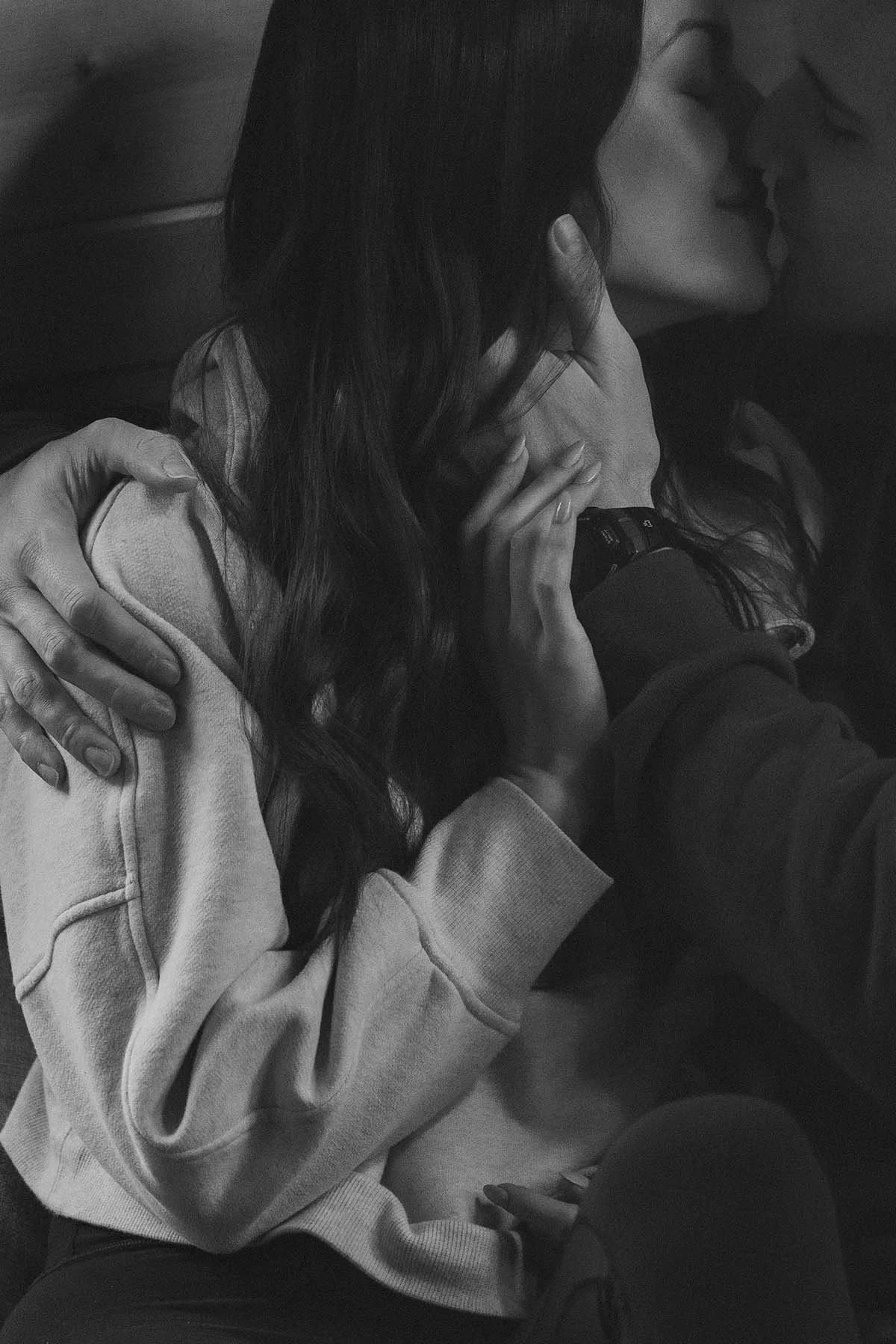 Wedding couple embrace before they get dressed for their elopement day