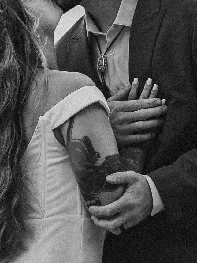 Bride and groom's loving embrace, cropped in a black and white edit to highlight the emotion of a Mount Rainier elopement