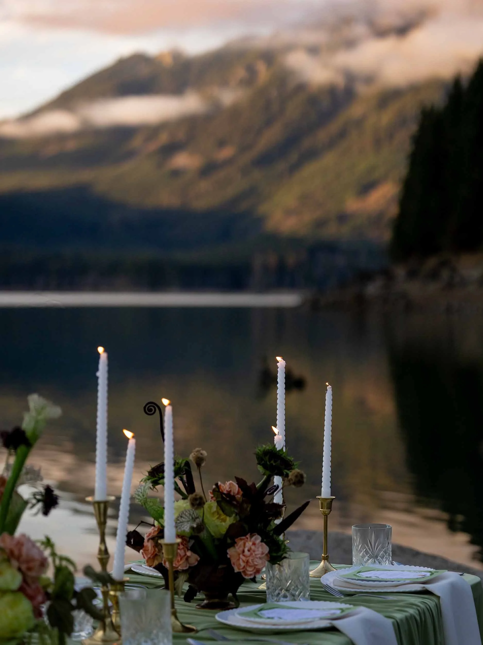Green and blush micro wedding tablescape with candles at the edge of Greider Lake in Washington.