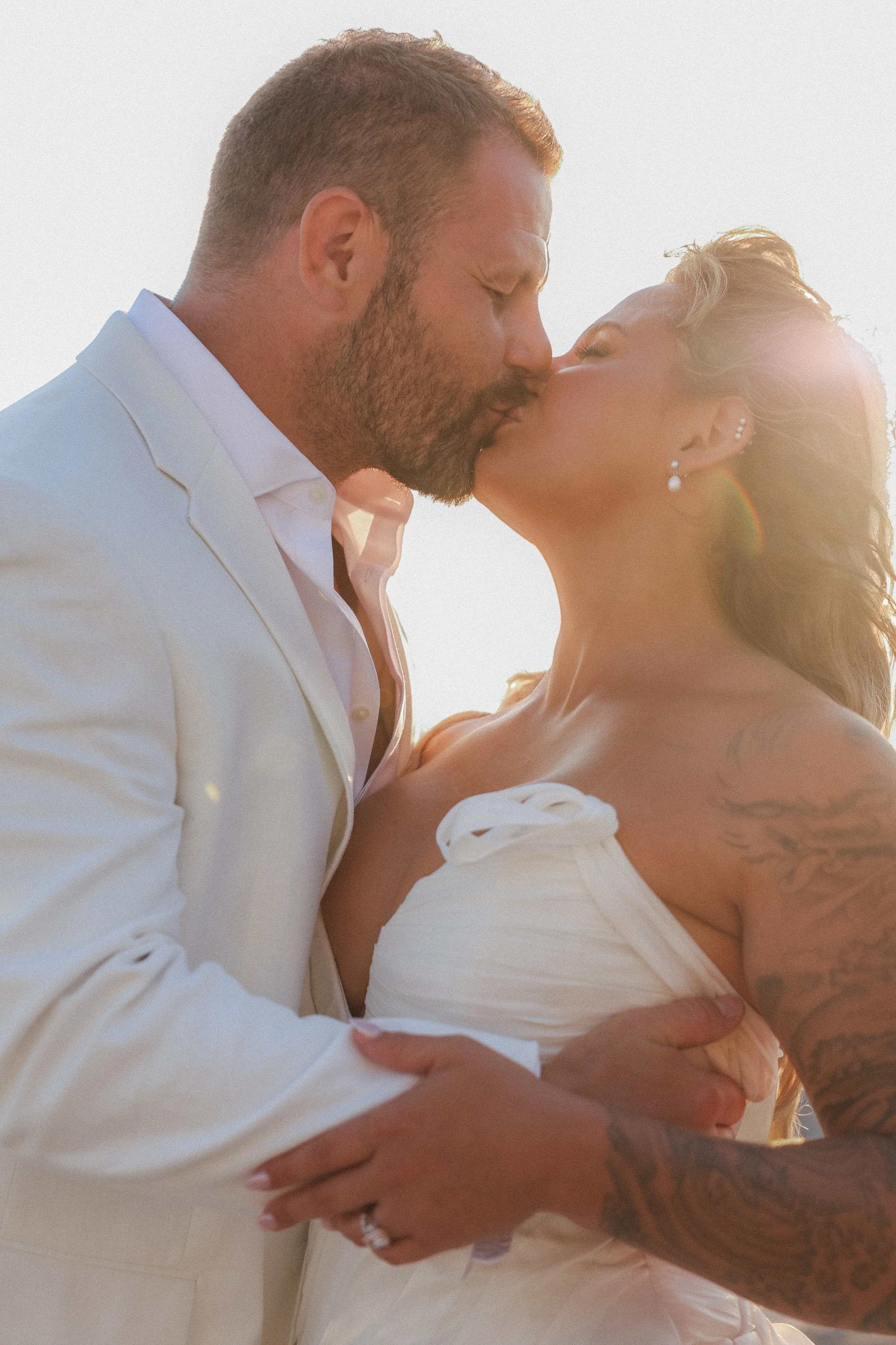Bride and groom, Hannah and Joe kissing at golden hour, St. Regis Longboat Key wedding, St. Regis Longboat Key wedding, Tampa Bay luxury wedding photographer Divine Design Photography
