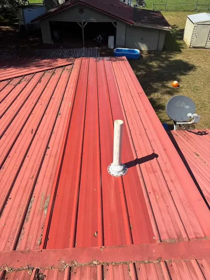 Storm damaged metal roof with rotted decking exposed during roof tear off by Big League Roofing