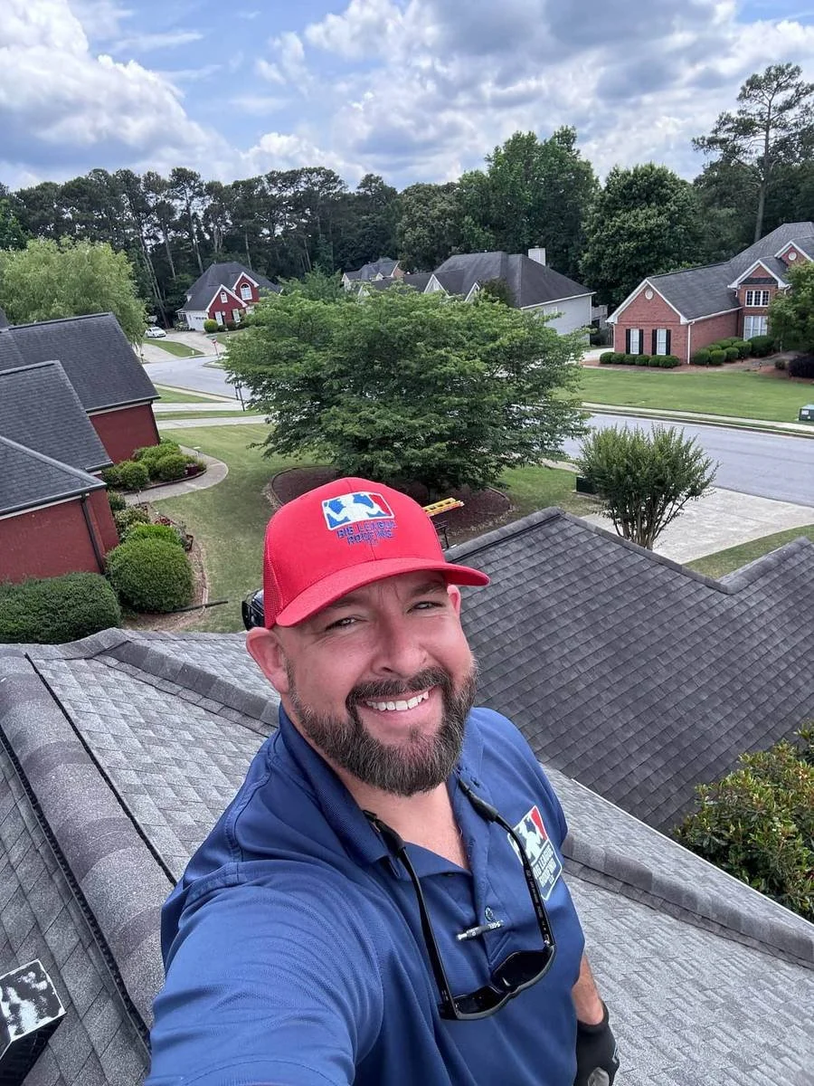 Tyler Addison, owner-operator of Big League Roofing, on a roof inspection