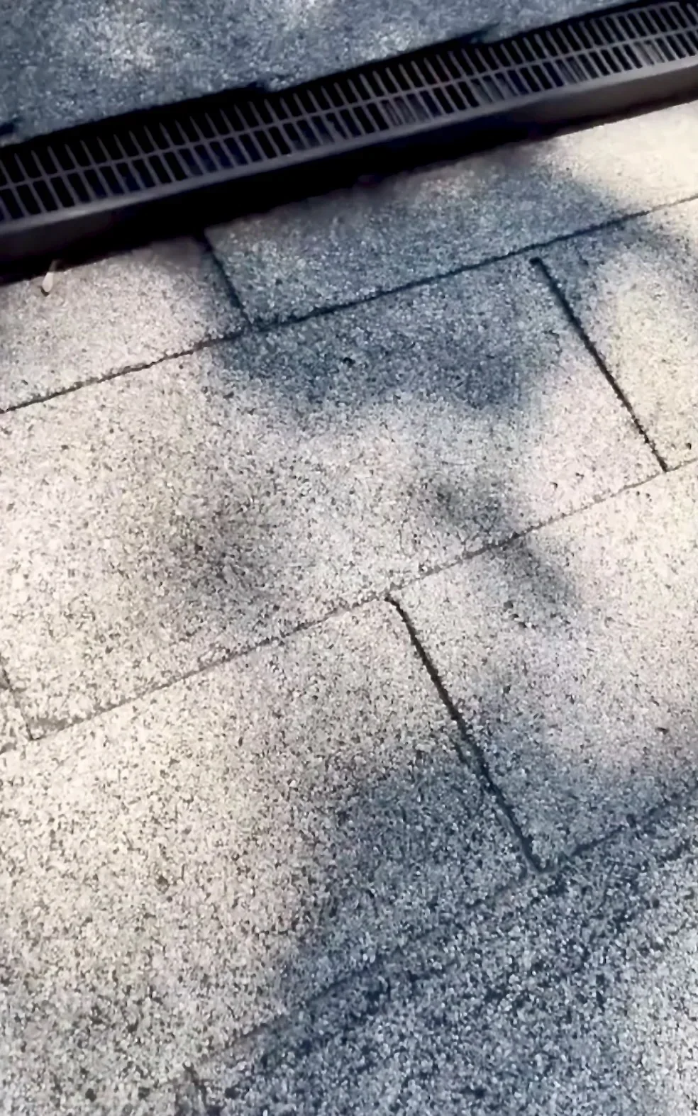 Wind damage creasing on 3-tab asphalt shingles on a Northeast Georgia roof