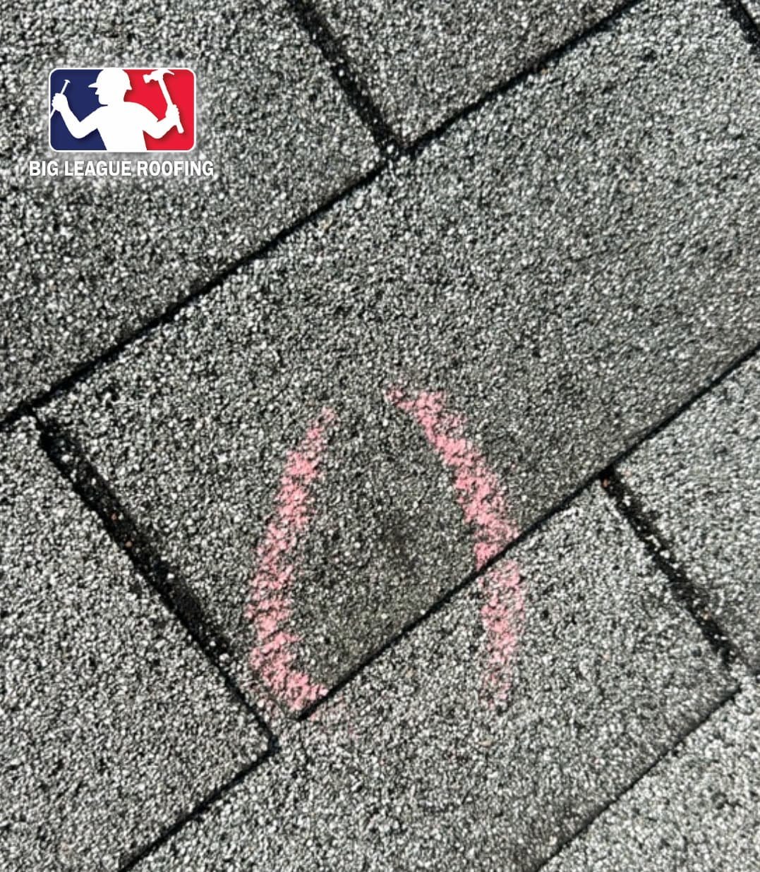Chalk mark on a shingle showing a hail impact point during a roof inspection in Winder, GA