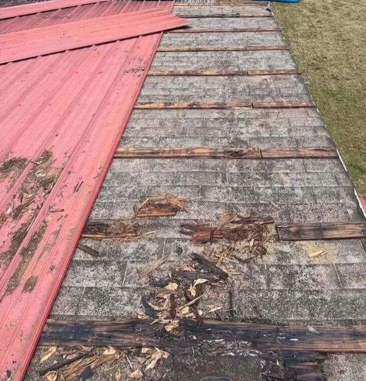 Storm damaged roof with missing shingles — Northeast Georgia roof repair