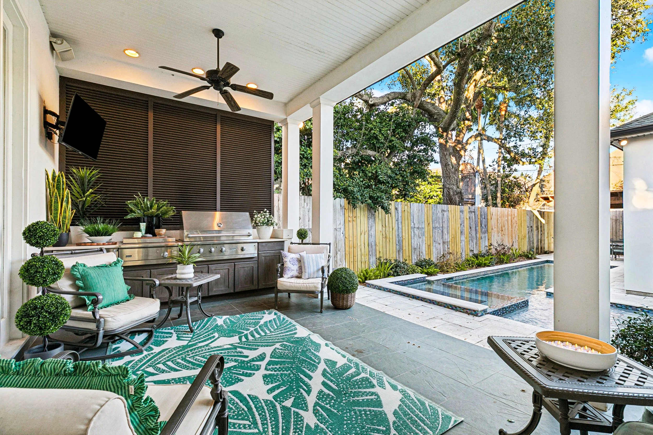 Aimee (Amay) Curole, 23 Realty, Luxury Listing Expert, Outdoor Luxury Covered Stoned patio, outdoor kitchen with Viking Grill, mini-refrigerator, saltwater heated pool.