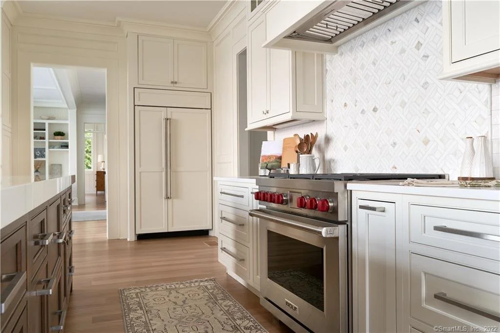 Wolf oven and fully panelized refrigerator in an Essex CT kitchen
