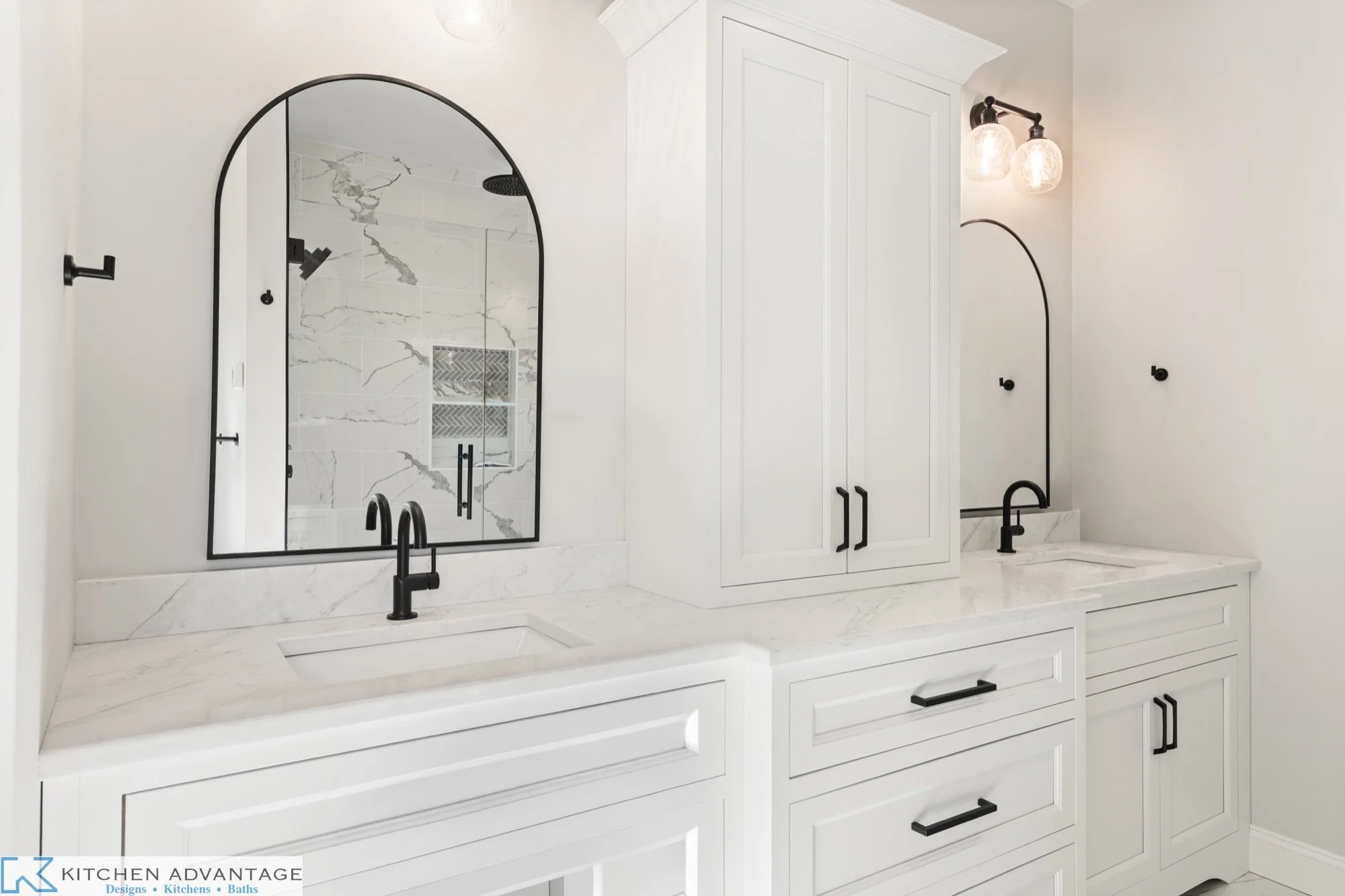White bathroom vanity cabinetry with two sinks and central storage