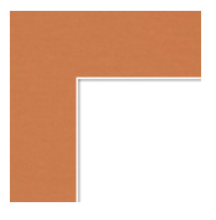 Close-up of a corner of a metallic copper-colored object with a white edge.