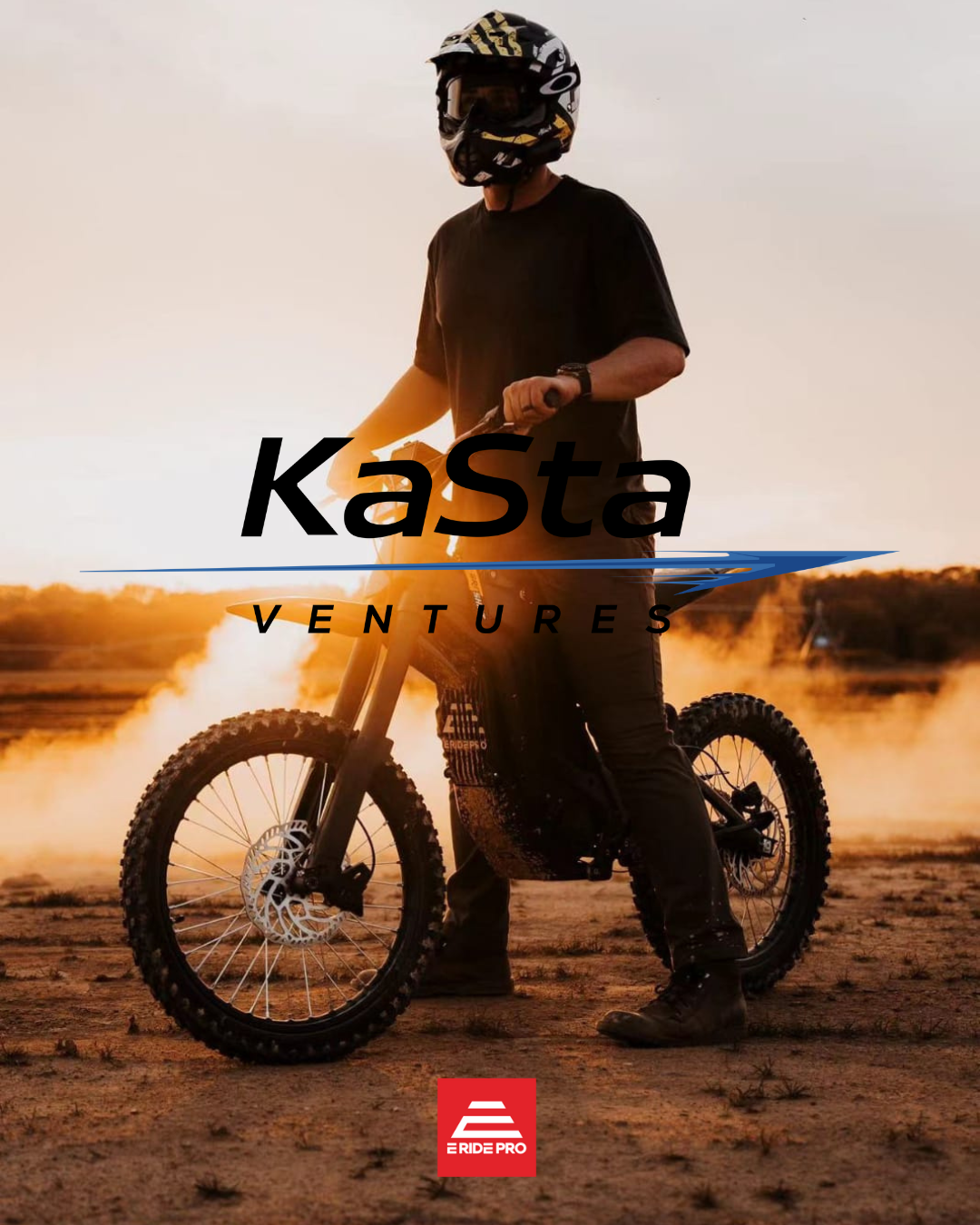 Person wearing a helmet standing beside an electric dirt bike in a desert at sunset with dust clouds behind.