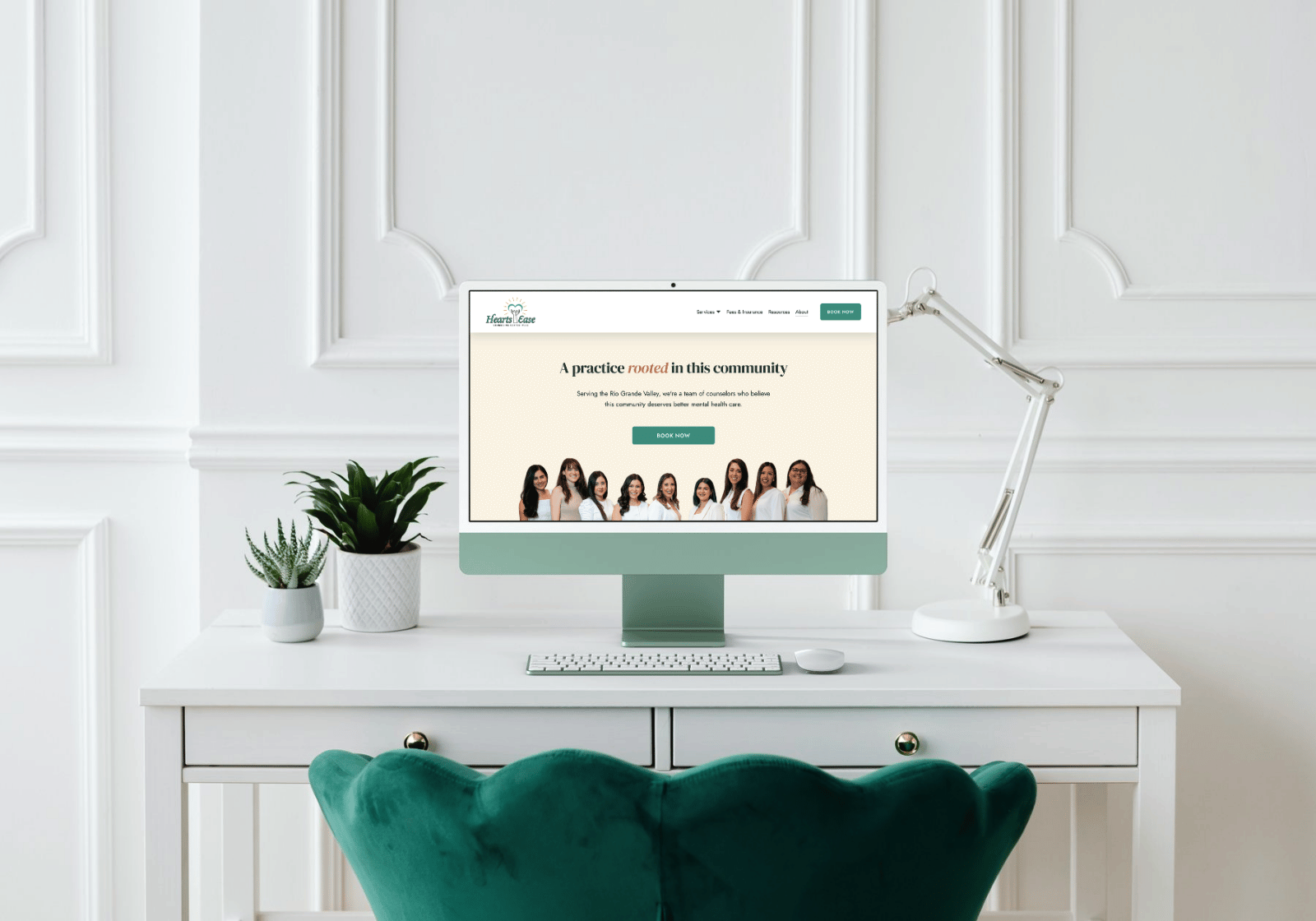 Desktop monitor mockup of the Heartsease Counseling Center website, showing the headline "A practice rooted in this community" and a team photo.