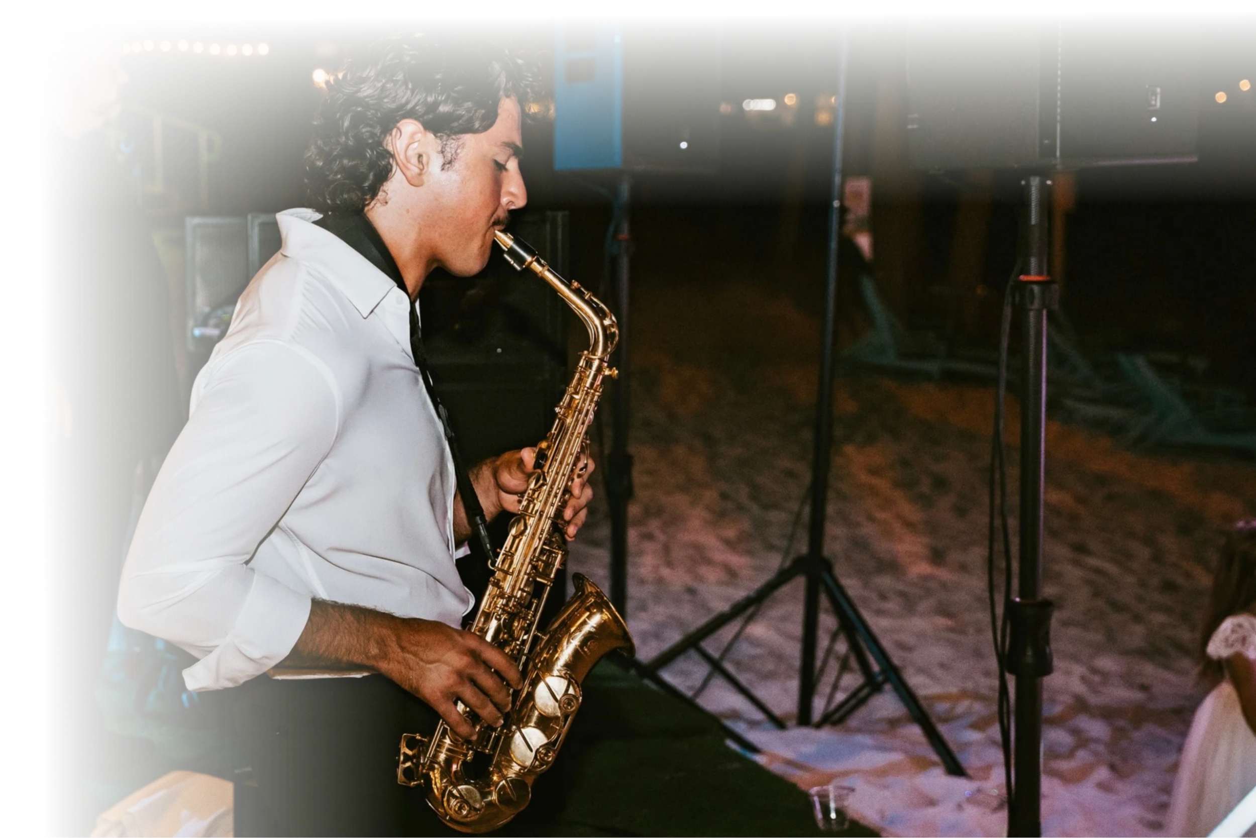 Vincent Imperial Jr. performing live saxophone at an elegant evening wedding reception