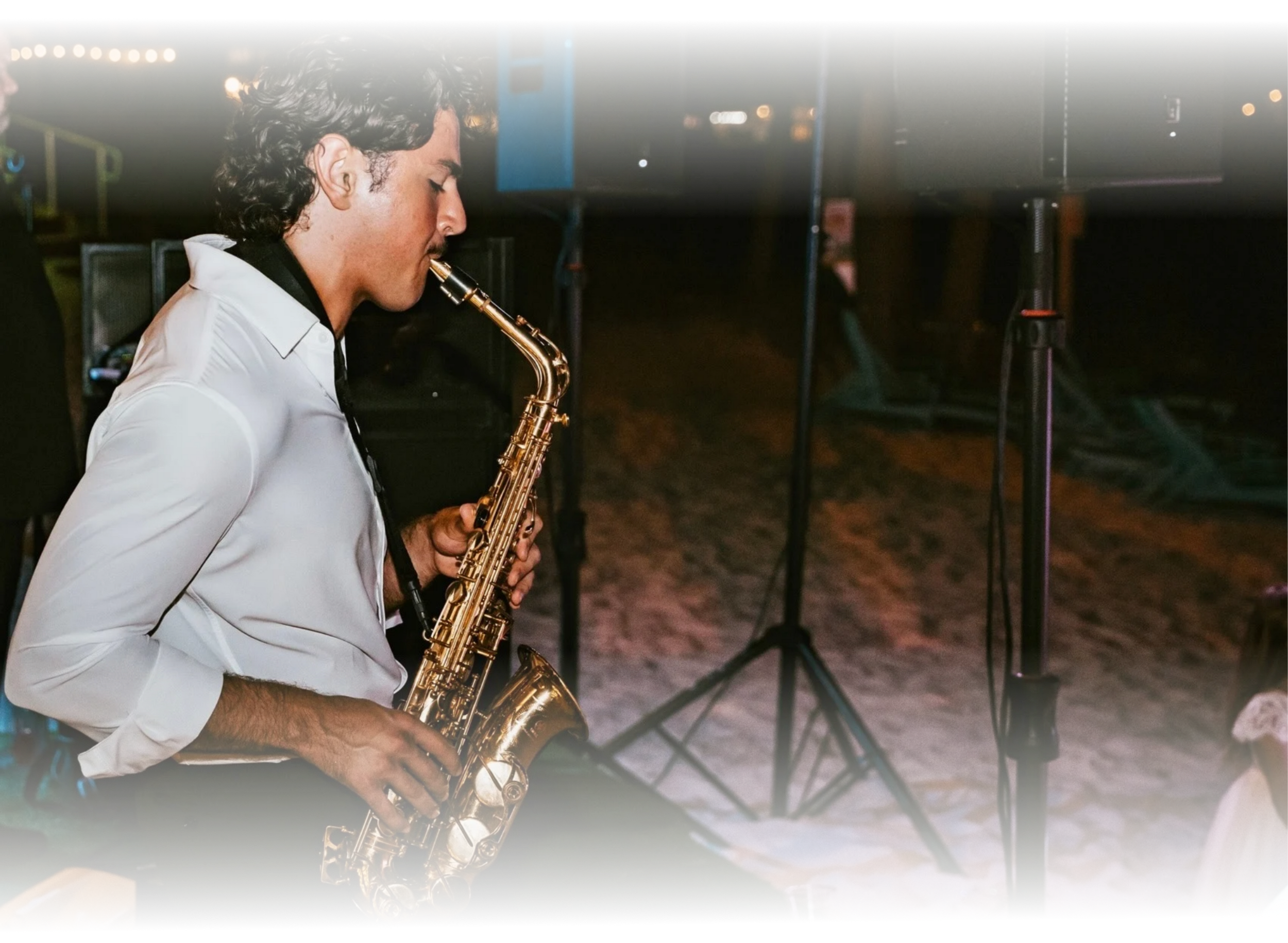 Vincent Imperial Jr. performing live saxophone at an elegant evening wedding reception
