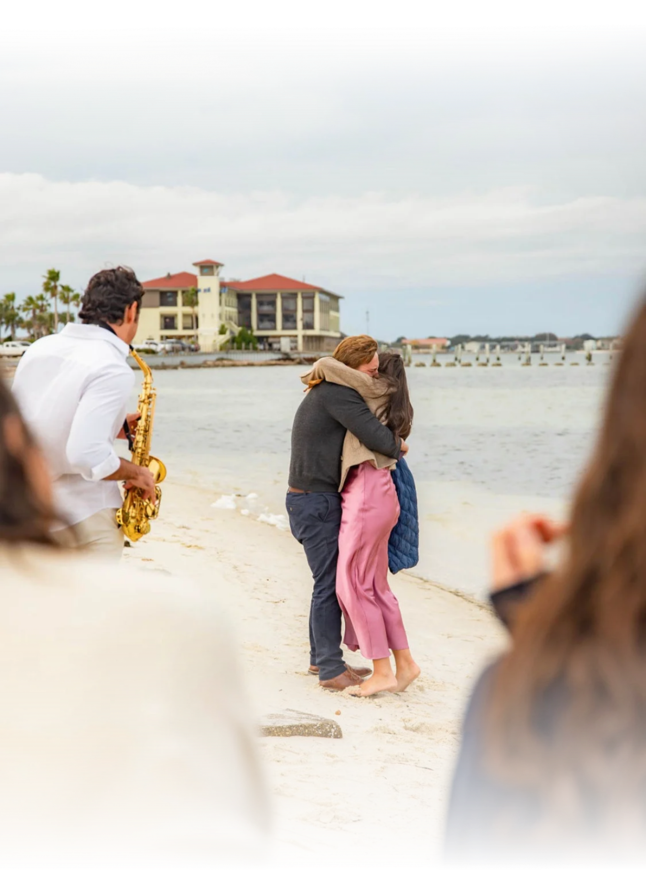 Live saxophone performance during a romantic beach proposal in Florida