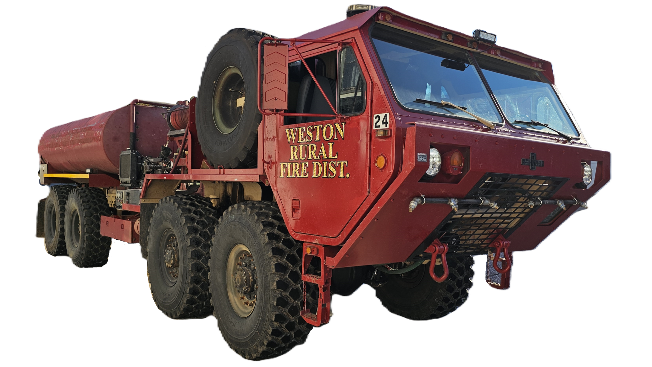 A large red all-terrain fire truck with multiple wheels, labeled 'Weston Rural Fire District,' featuring a water tank, a spare tire on the side, and various firefighting equipment, isolated on a white background.