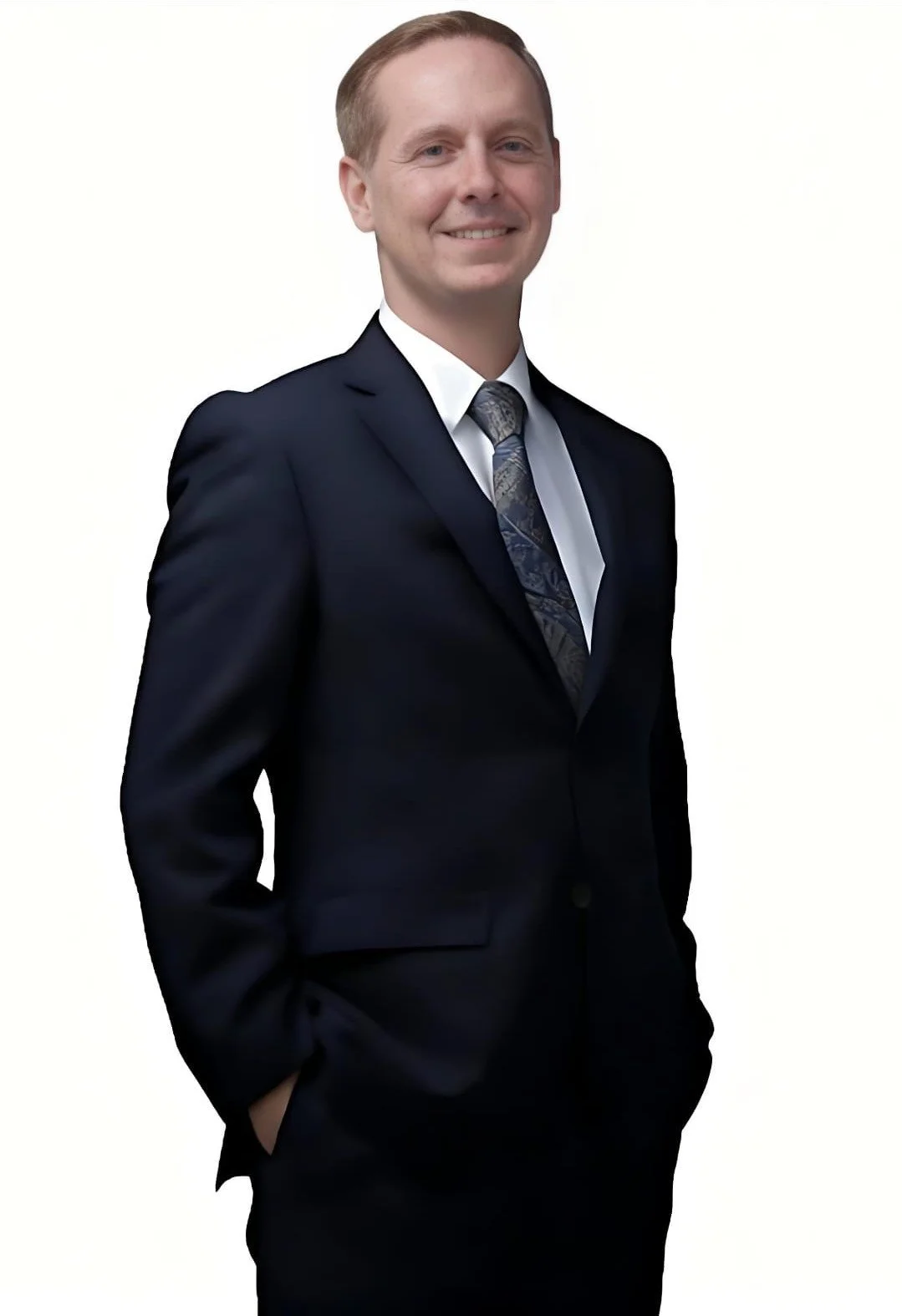 Evan smiling, hands in pockets