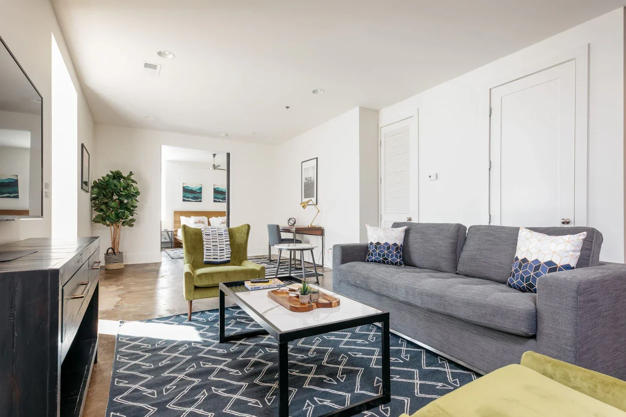 Living room with furniture and view of bedroom.
