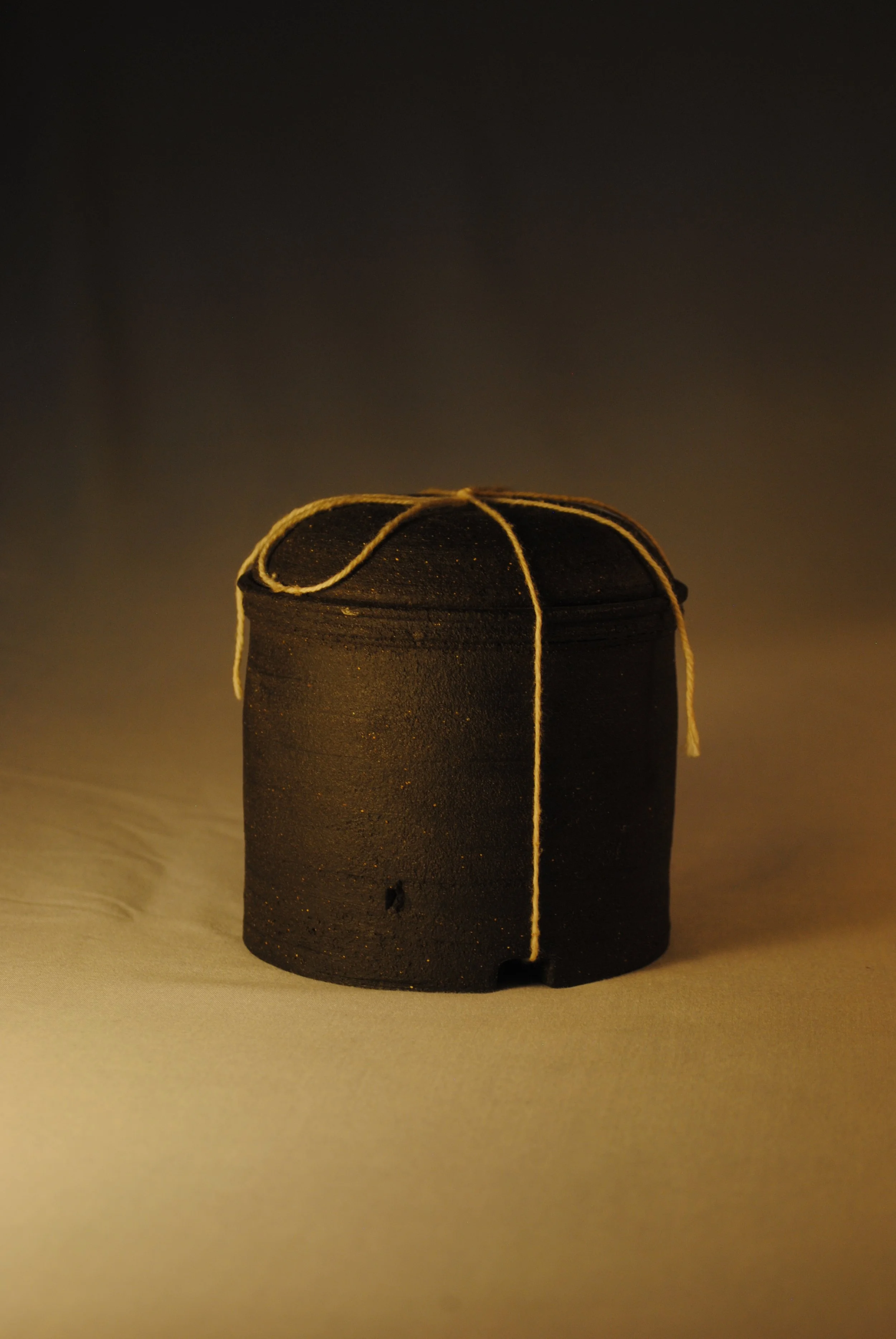 lidded jar w/ string
