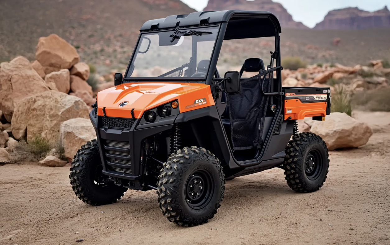 Orange utility 4x4 vehicle with black accents, large off-road tires, and a cargo bed, parked on desert terrain with rocks and mountains in the background.