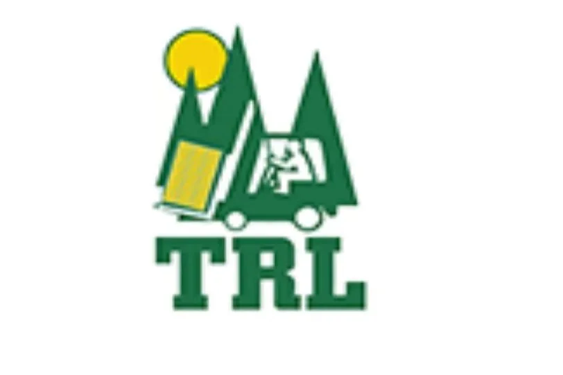 A green truck with trees and a yellow sun on top, with the letters 'TRL' underneath.