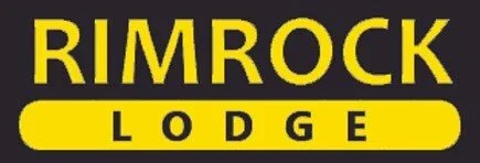 Sign for Rimrock Lodge with black background and yellow text