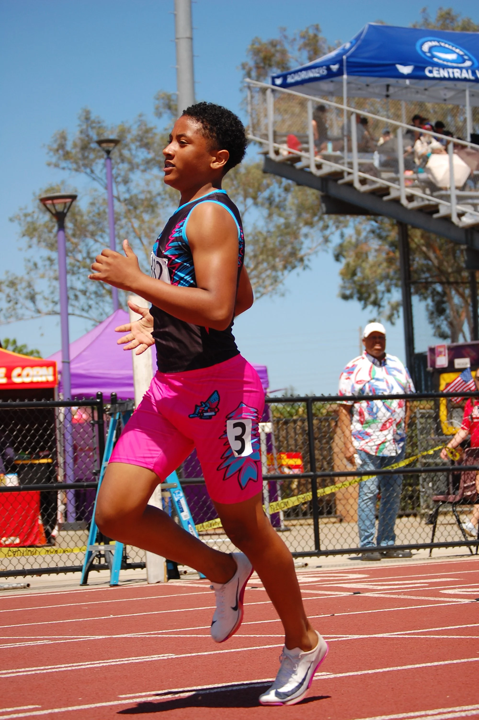 Track & field athlete captured mid-race by Bay Area sports photographer Najee Smith Creative
