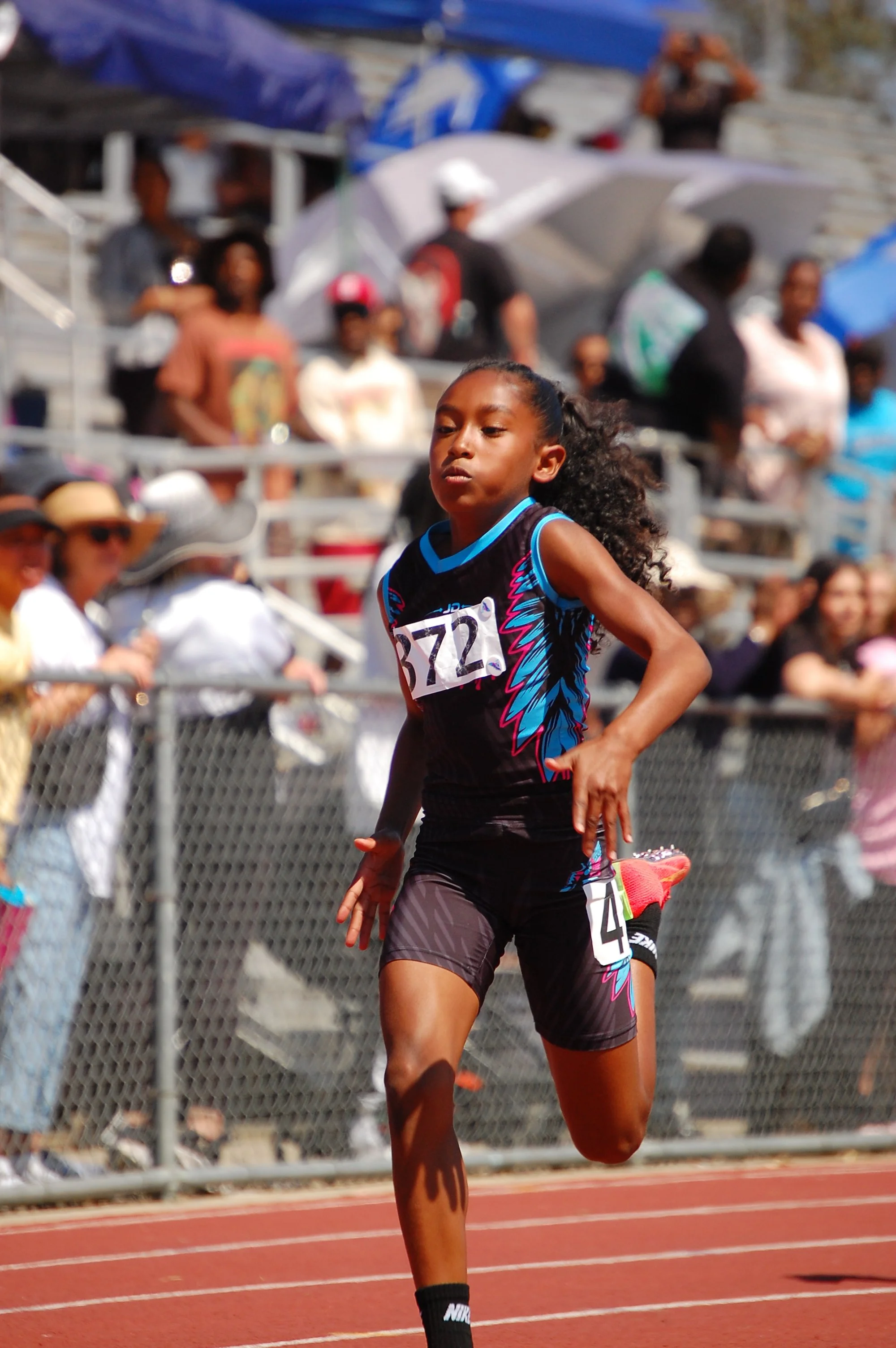 Action sports photography featuring a track athlete during a sprint event in the Bay Area.