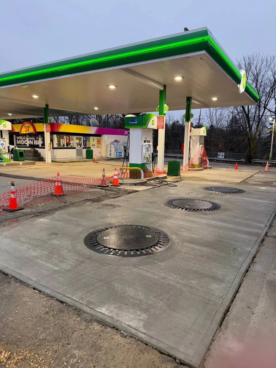 Concrete repair and manhole leveling at gas station project in Pittsburgh