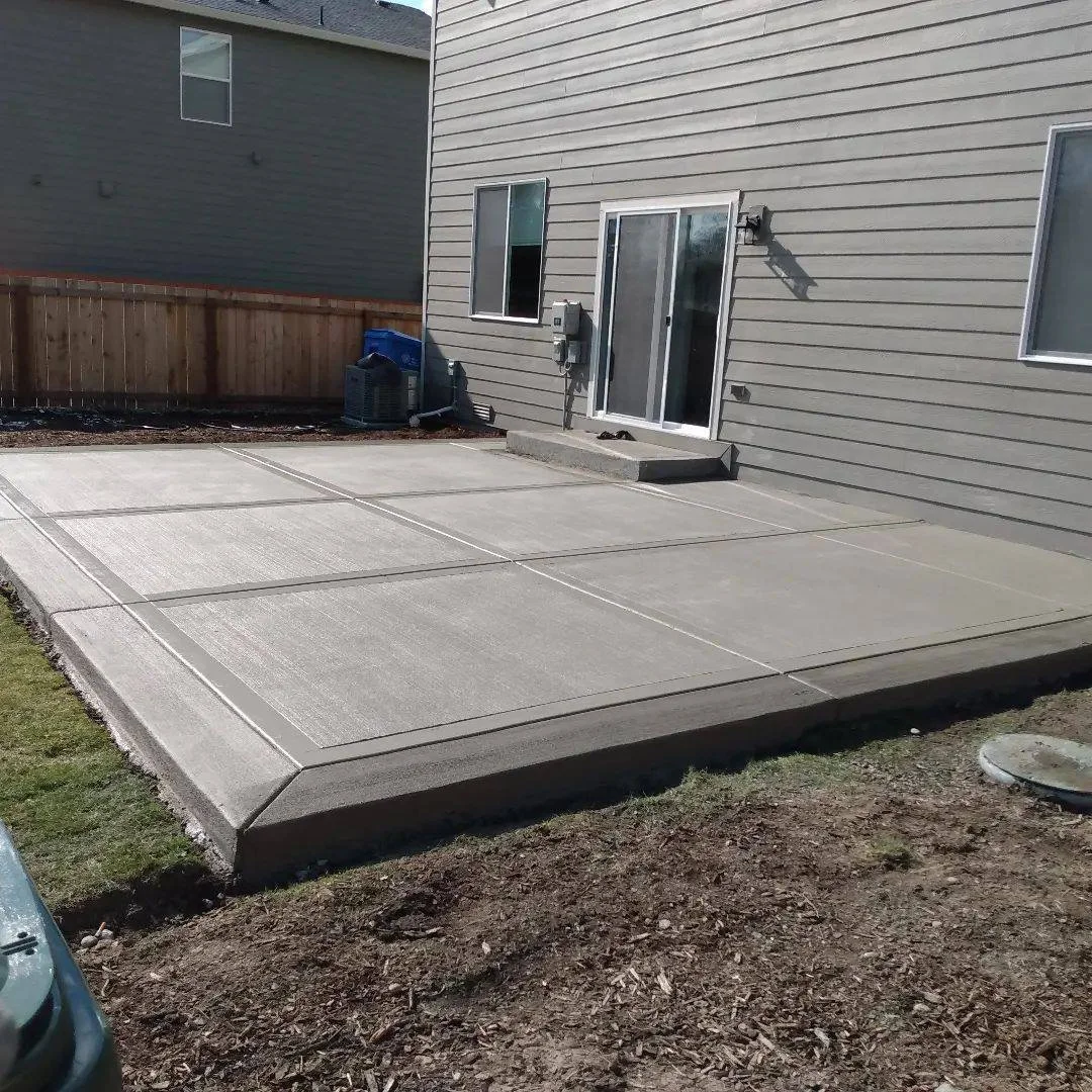 Backyard concrete patio construction with clean finish in Pittsburgh