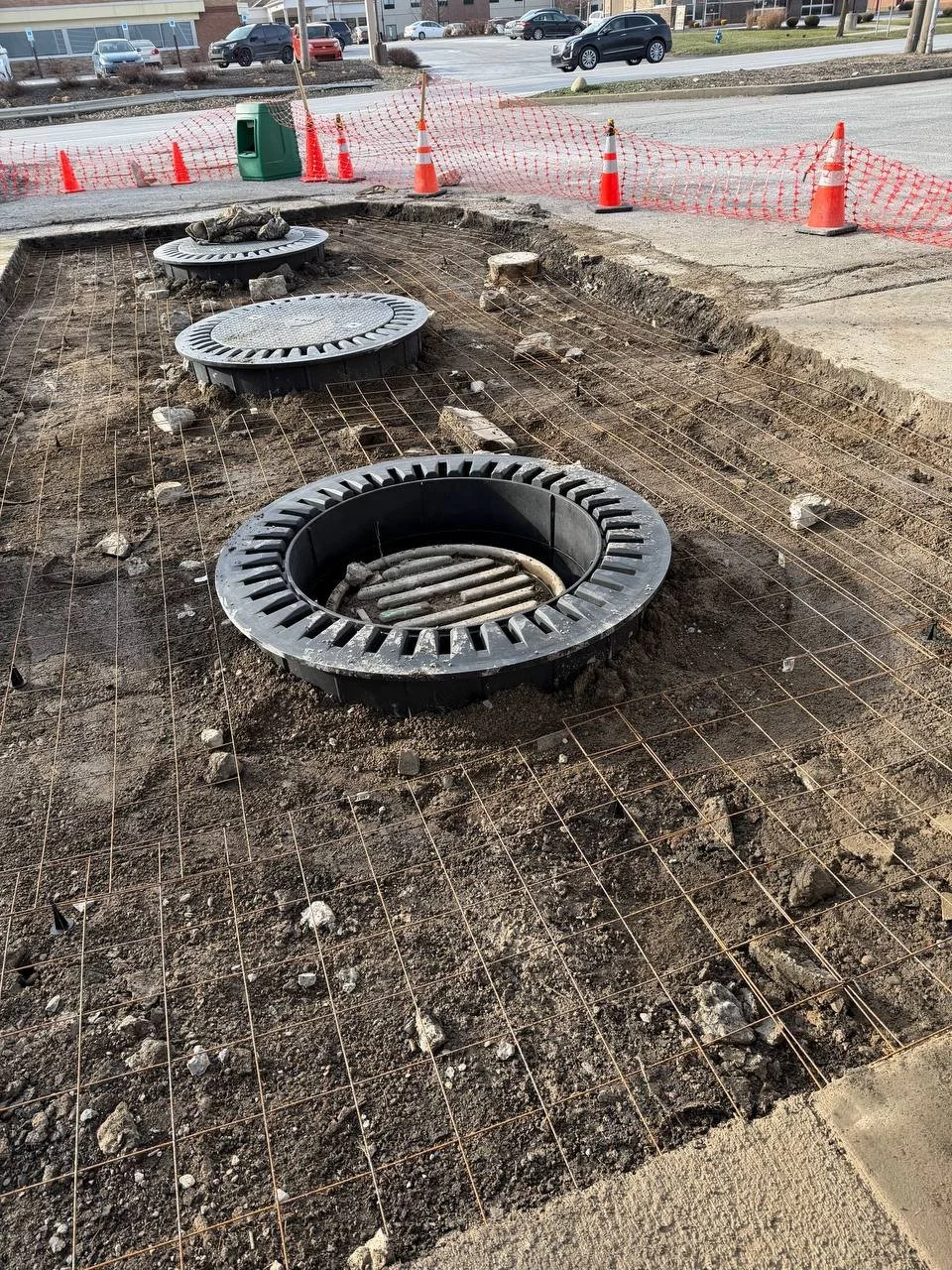 Commercial concrete work with manhole cover installation in Pittsburgh PA